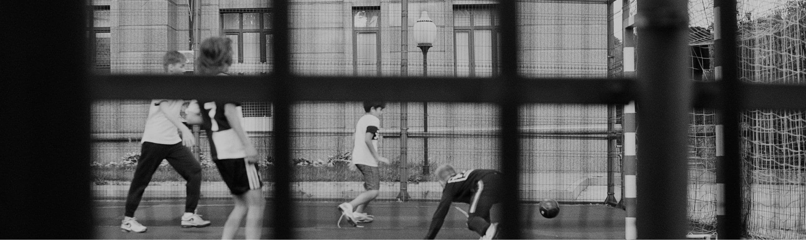 Kids playing soccer indoor